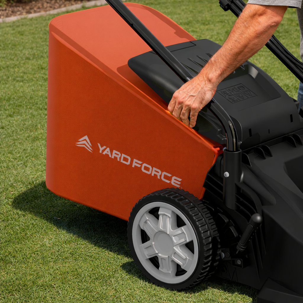 Person using a Yard Force lawn mower on grass